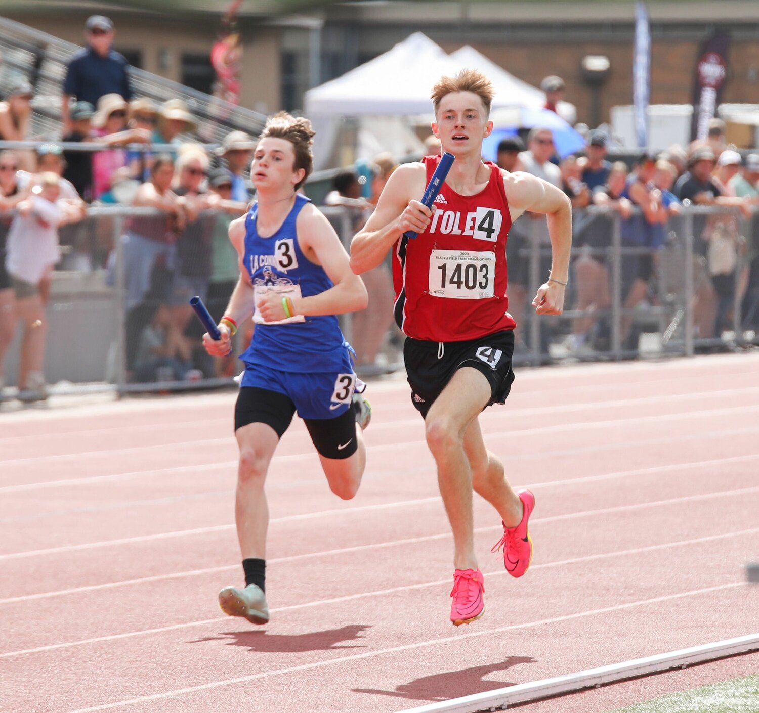Connor Olmstead pulls into the lead in the final lap of the 2B boys 4x400 relay at the state championships, May 26 in Yakima.