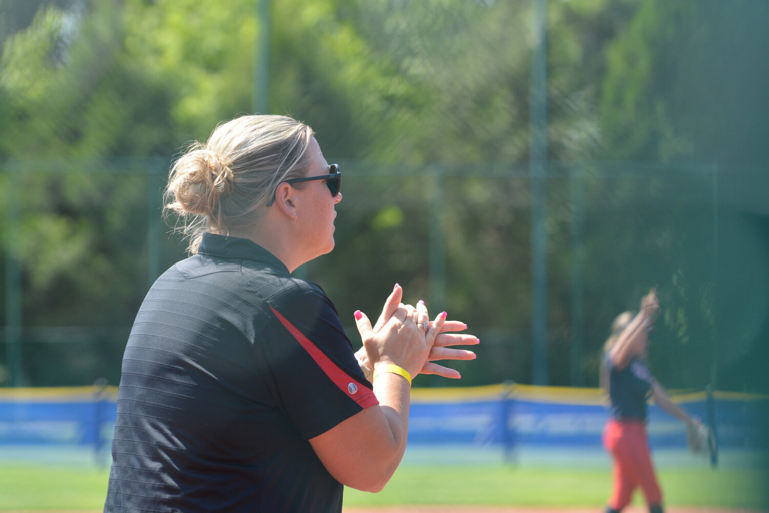 Head coach Lindsay Walton claps as Yelm plays Juanita on May 25 in Lacey.