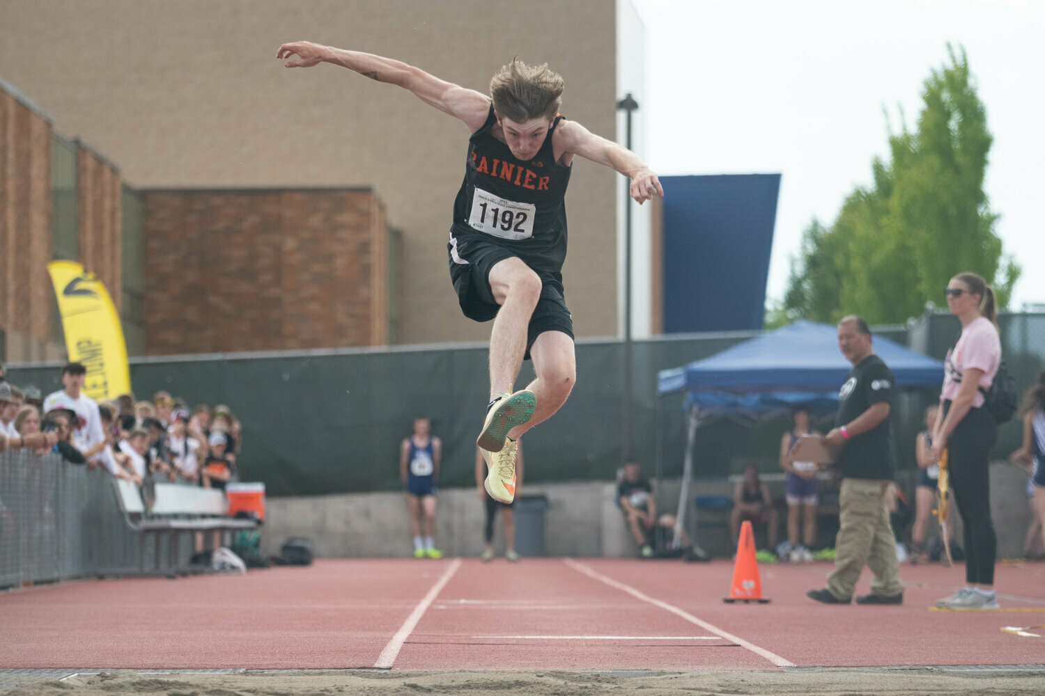 Rainier's Chase MacFarland goes flying in the triple jump finals at the 2B state championships at Zaepfel Stadium in Yakima on Thursday, May 25. MacFarland placed fifth.