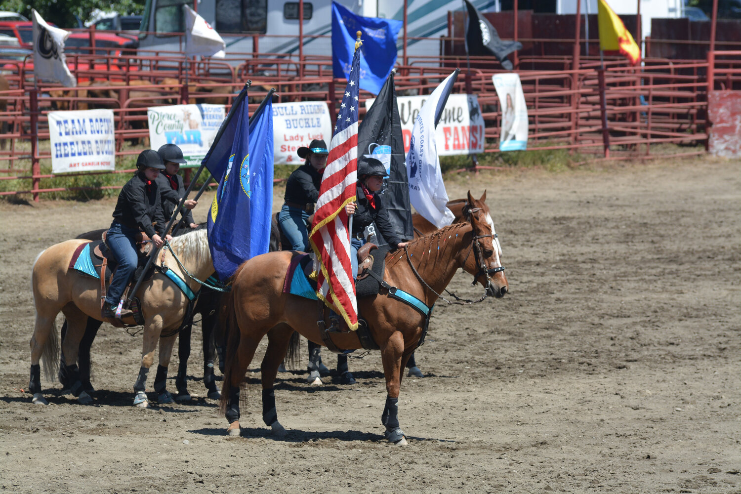 Cowgirls present the colors before the start of the Roy Pioneer Rodeo on June 4.