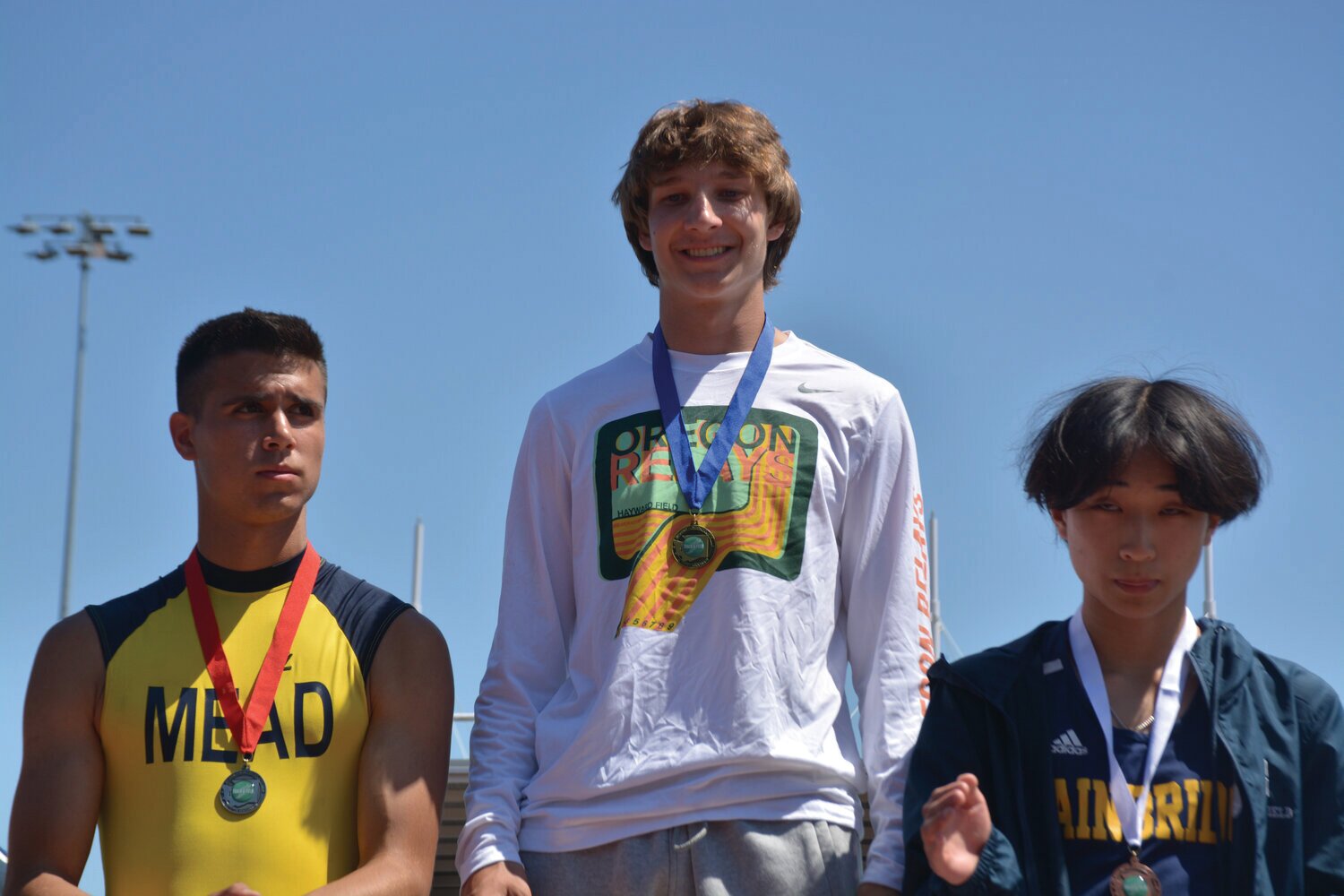 Jordan Lasher smiles atop the podium after a championship victory in the 3A pole vault competition on Friday, May 26.