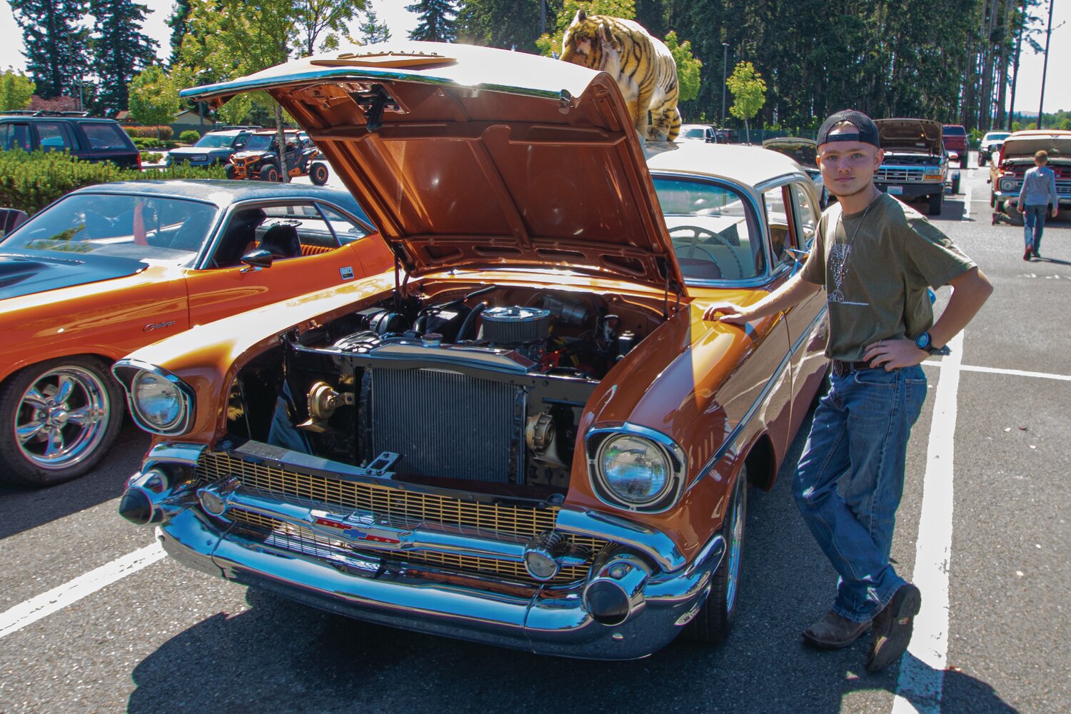 Yelm High School freshman Trenton McKinley shows his grandparents’ 1957 Chevrolet Del Ray Club Coupe at the Yelm High School car show on Sunday, June 4.