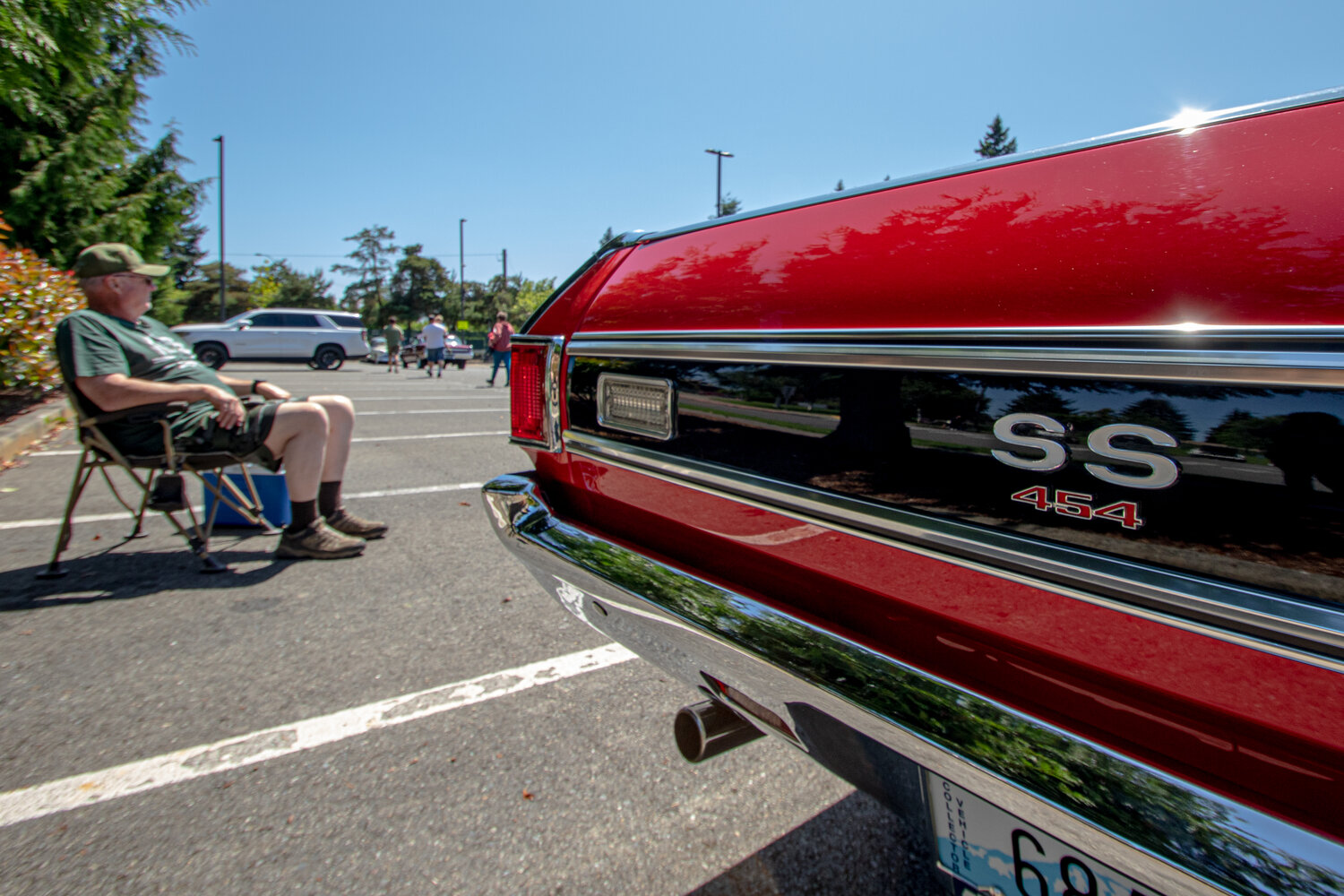Bill Kendall sits next to his 1972 Chevrolet El Camino SS at Sunday's Yelm High School car show.