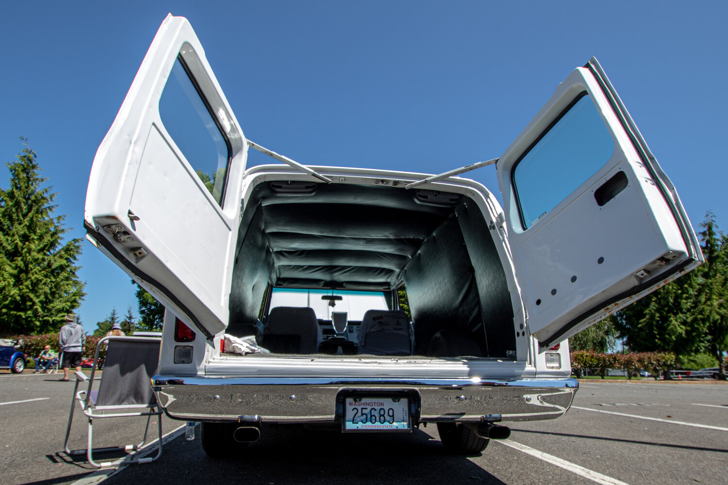 The trunk doors of Jay Gregory's 1970 Chevrolet C/10 panel truck point toward the sky while the truck was displayed at the Yelm High School car show on Sunday, June 4.