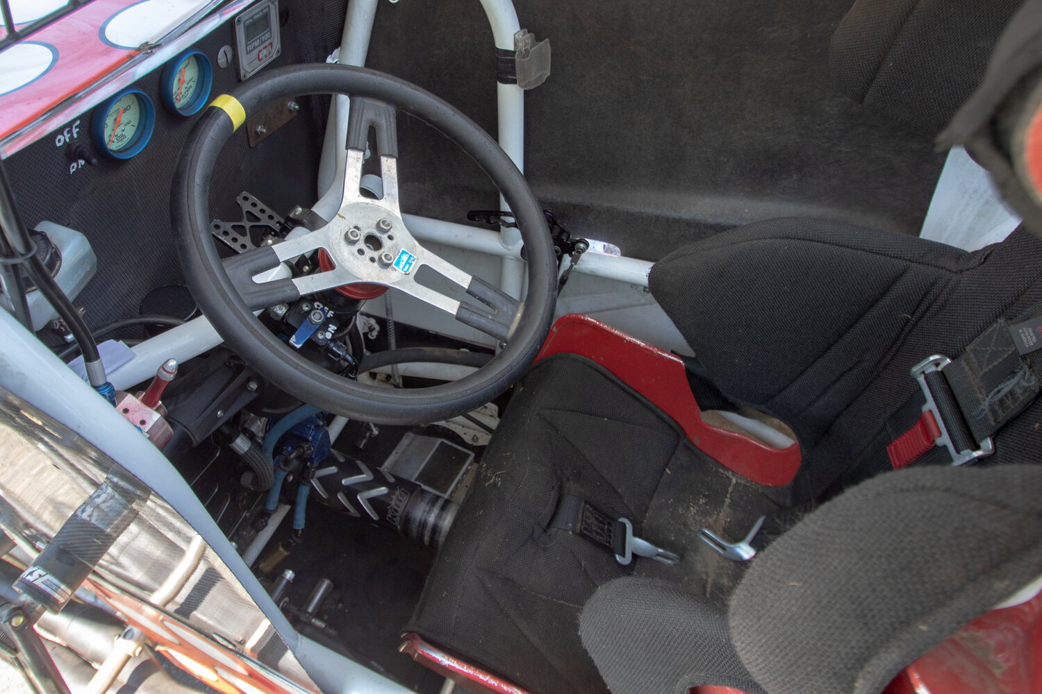 Although owner Chris Greene claimed it was roomy in the driver's seat of his sprint car, the racecar's drive shaft can be seen directly between where the driver's legs would be.