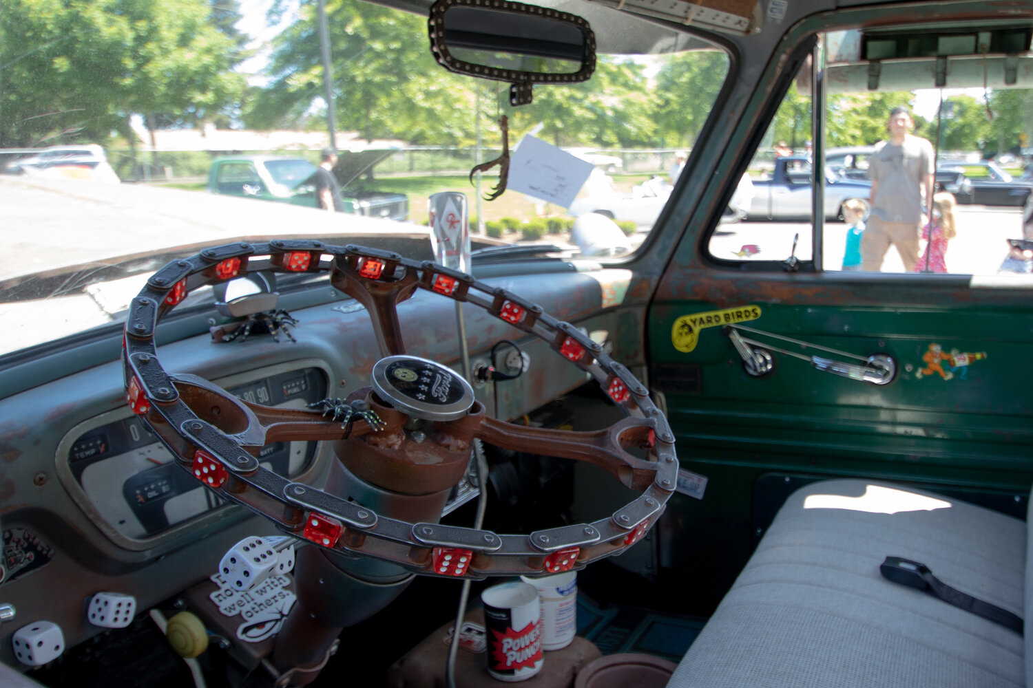 A custom red dice-decorated steering wheel sits on display in Russ and Linda Becker's 1953 Ford F-100 "Old Rat" truck at the Yelm High School car show on Sunday, June 4.