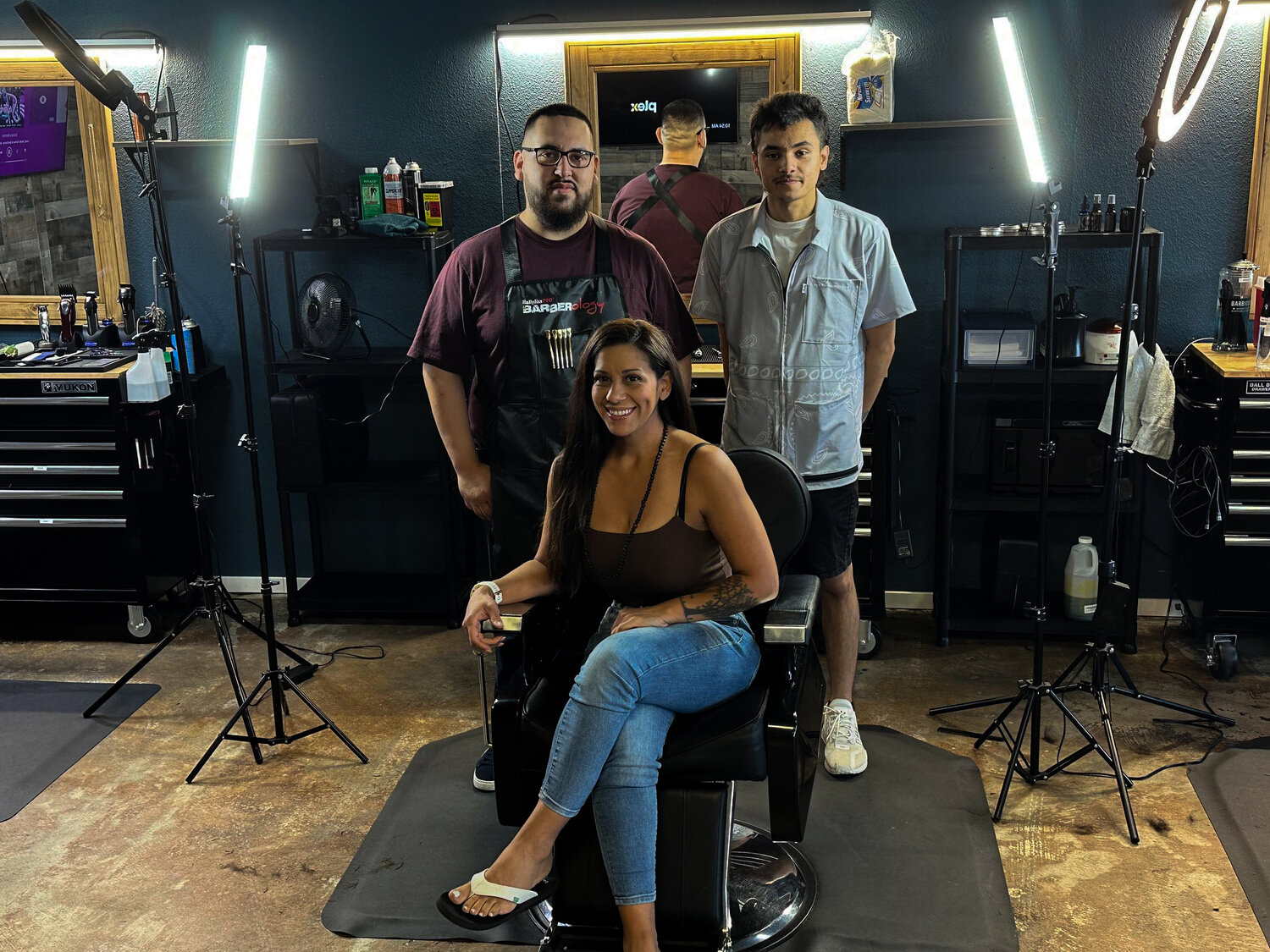 Jacob Dimond / Nisqually Valley News
Barbers Kali Tatu, front, Daniel Carrasco, back left, and Manny Diaz, back right, pose for a photo at Northwest Barber Lounge.