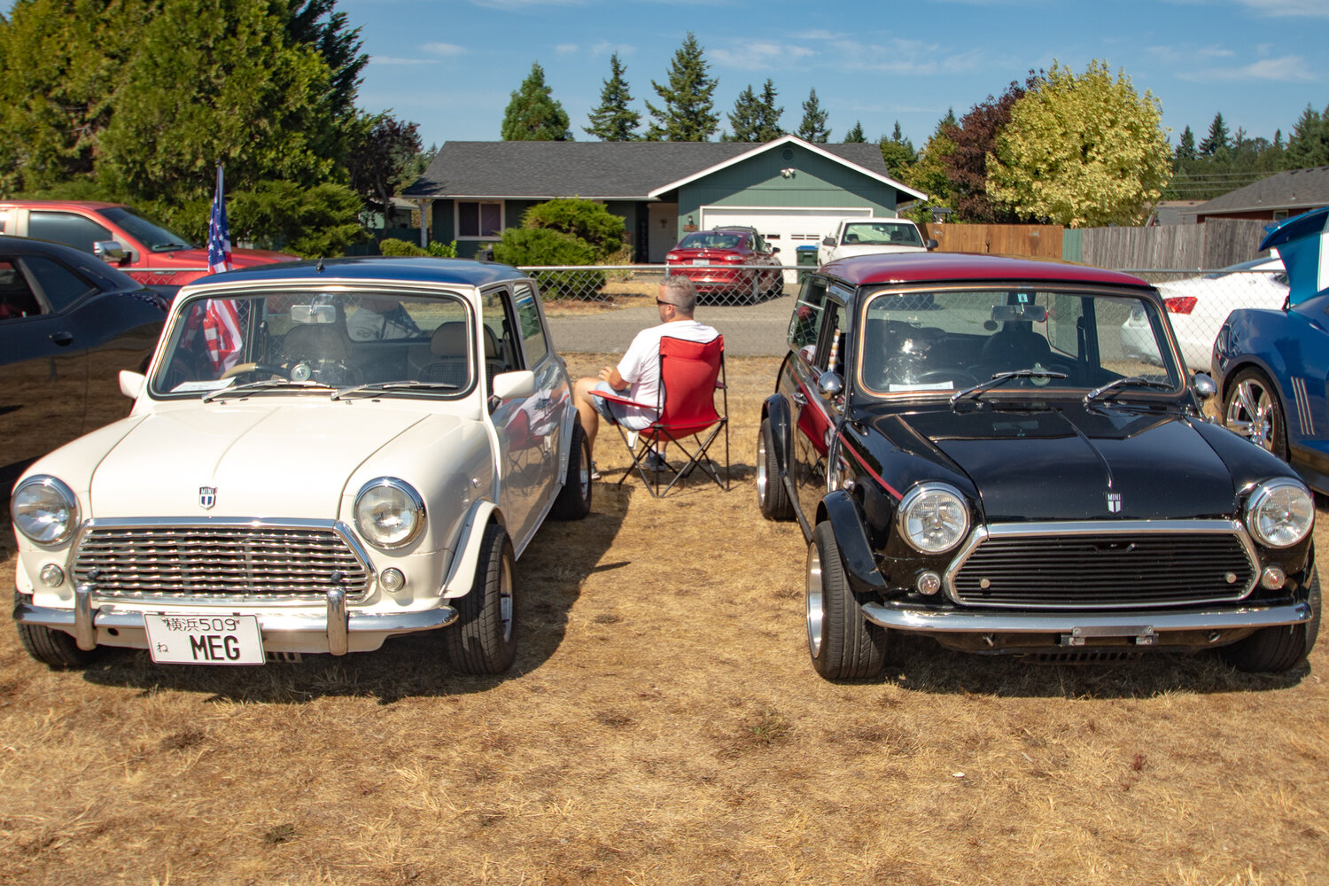 A 1996 Mini Cooper Rover owned by James Thompson of Graham, left, sits next to a 1992 Mini Cooper Rover owned by Ben Compton of Port Orchard on Saturday, Sept. 2 in Wilkowski Park for the 16th annual Military Heroes Car Show in Rainier.