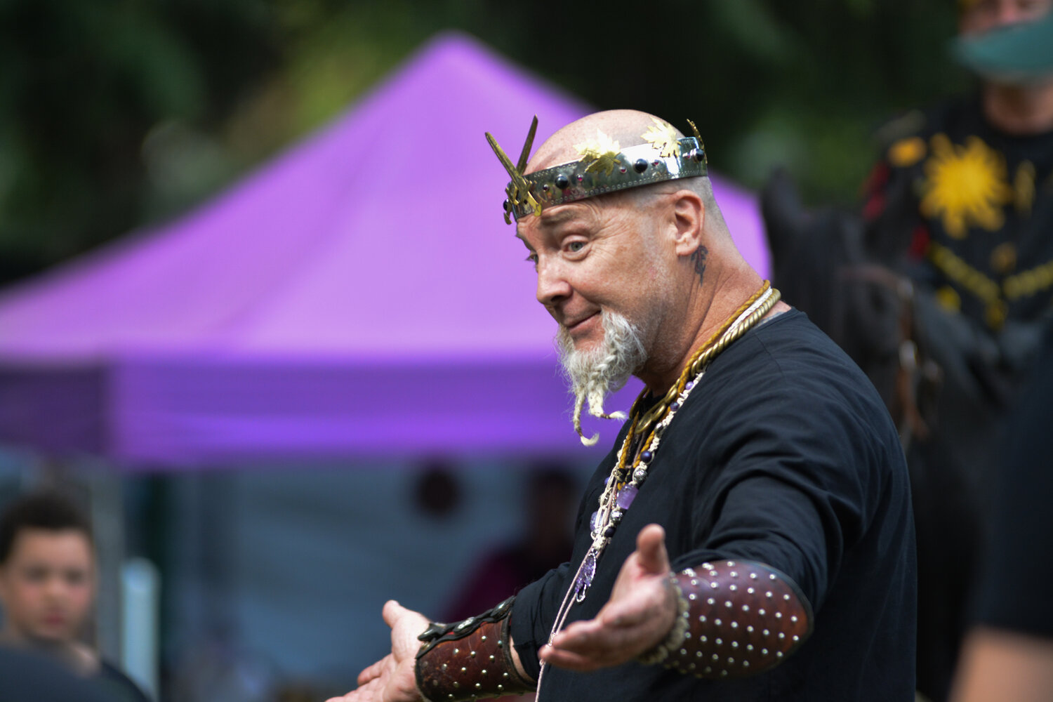 Captain Bill Koutrouba shrugs and smiles in a conversation at the Norse West Viking Festival on Sept. 10.