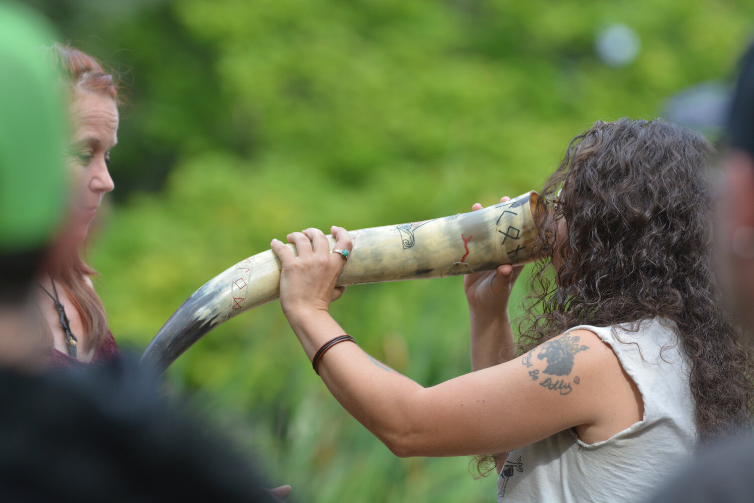 An attendant of Vegtam’s ceremony at the Norse West Viking Festival on Sept. 10 drinks blessed mead from a drinking horn.