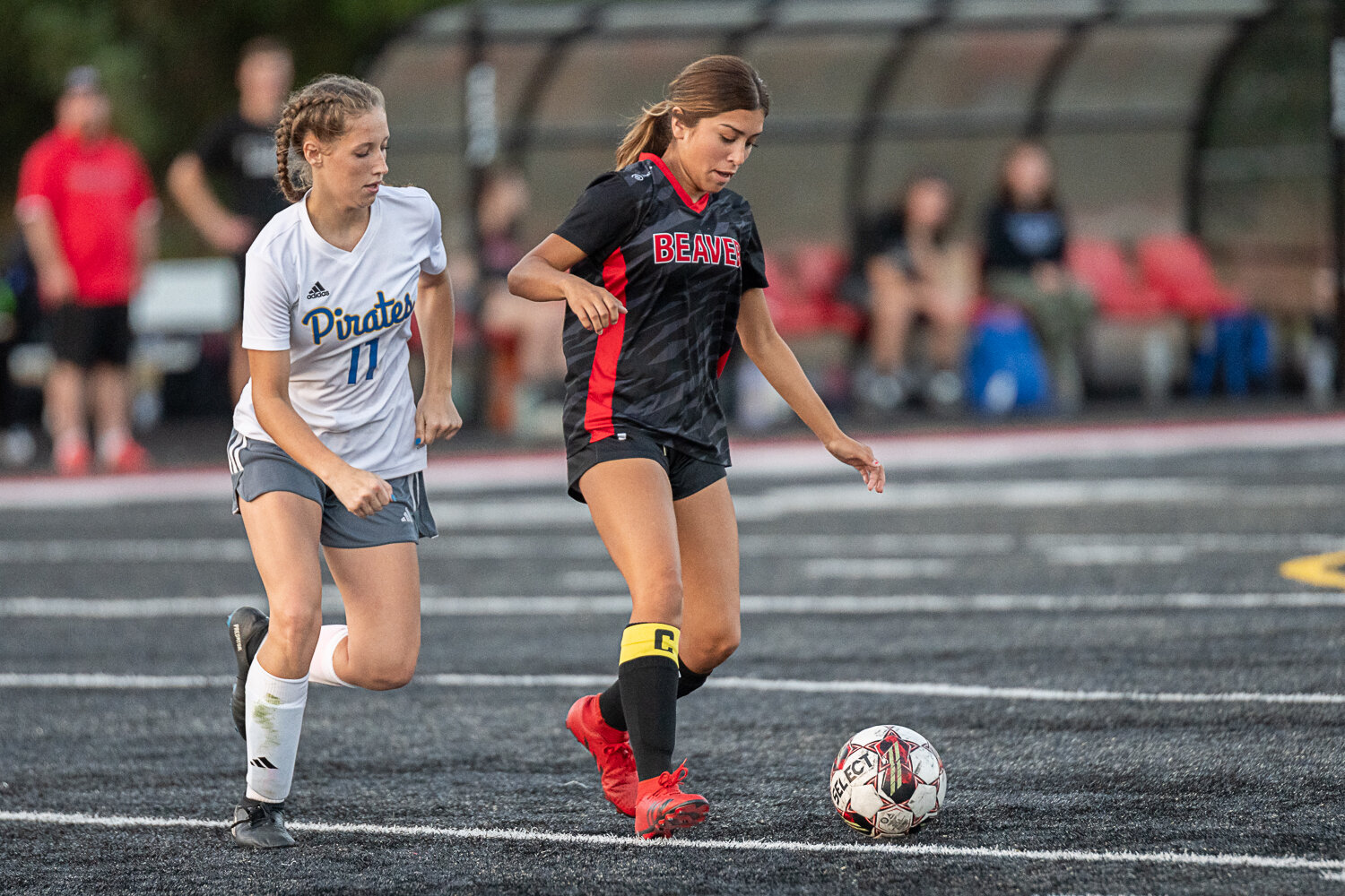 Tenino's Paisley Garcia tries to evade Adna's Bailey Naillon during the Beavers' 0-0 tie against the Pirates on Sept. 14