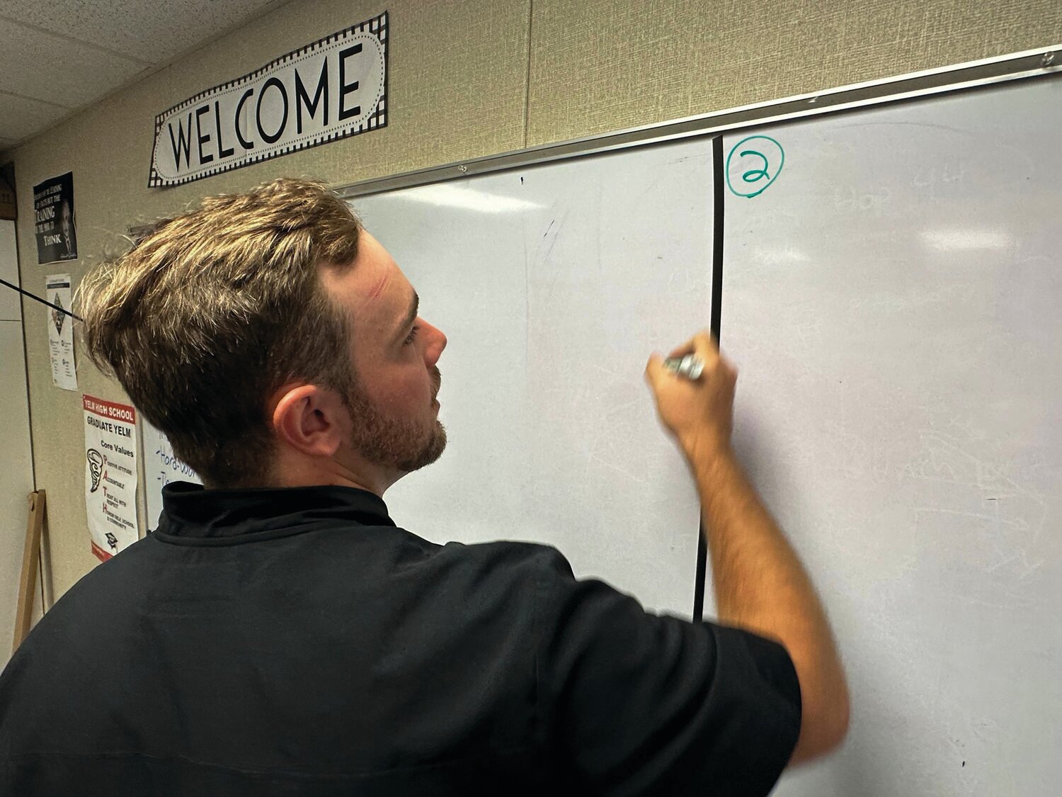 New Yelm High School teacher Dakota Hill prepares his classroom for the first day of school on Sept. 4.