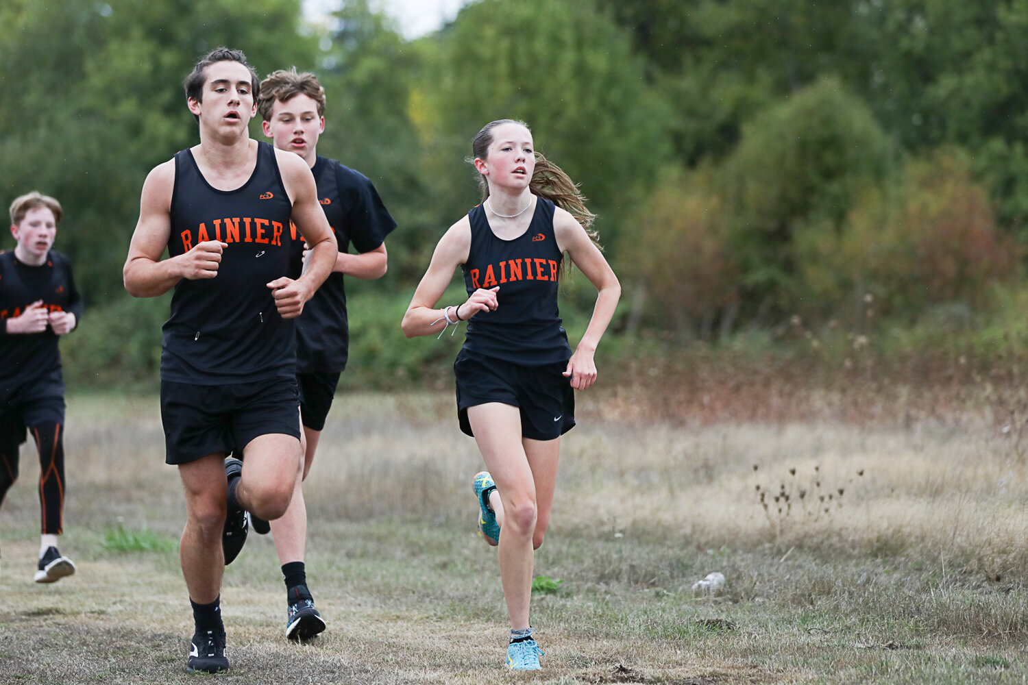 Rainier's Madison Ingram runs next to teammate Zander Peck during a 2B meet at Adna on Sept. 28. Ingram ran with the boys and finished in 15:46, good enough for 11th in that race and first in the girls' field by over 90 seconds.