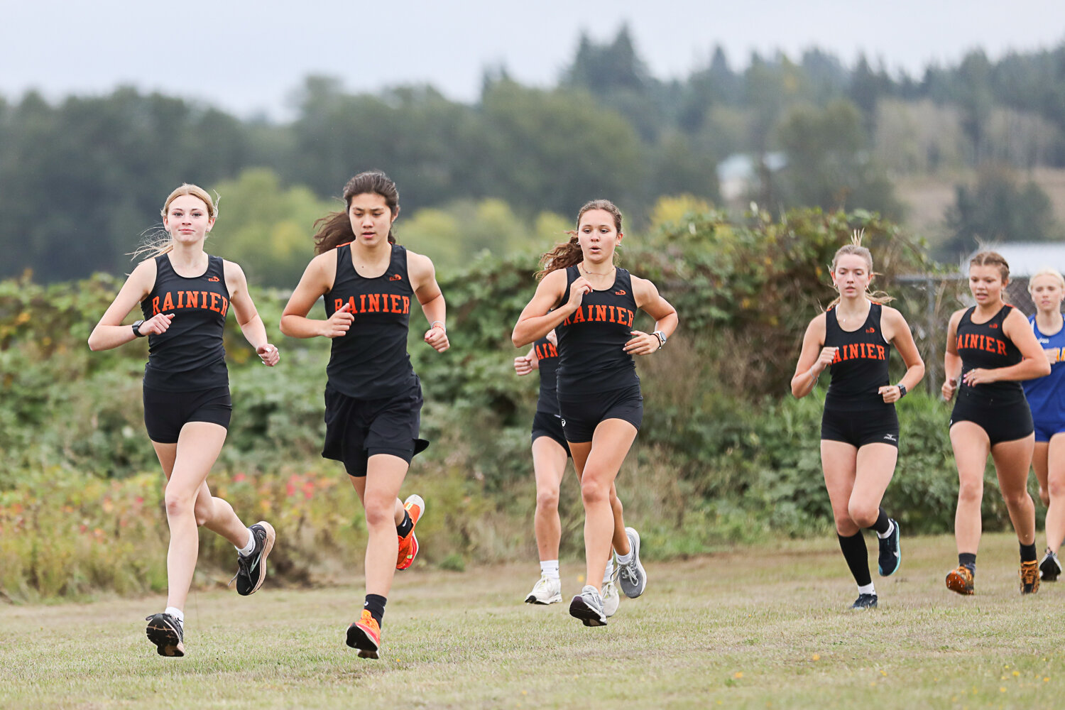Six Rainier runners surge to the front of the pack early in a Central 2B League race at Adna on Sept. 28.