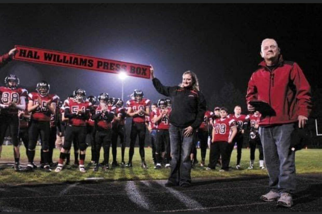 Hal Williams is stands in front of the football field at Tenino  on the night that the Beavers named the press box at Beaver Stadium in his honor in 2013.