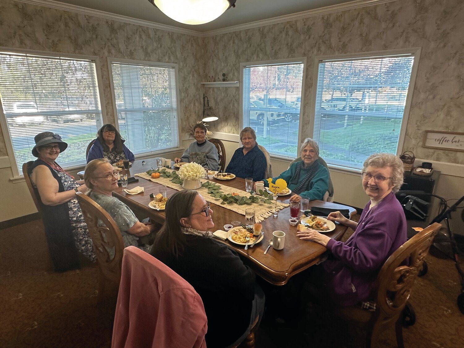 Attendees of Prestige Senior Living Rosemont’s Thanksgiving luncheon smile as they enjoy a traditional Thanksgiving meal on Nov. 17.