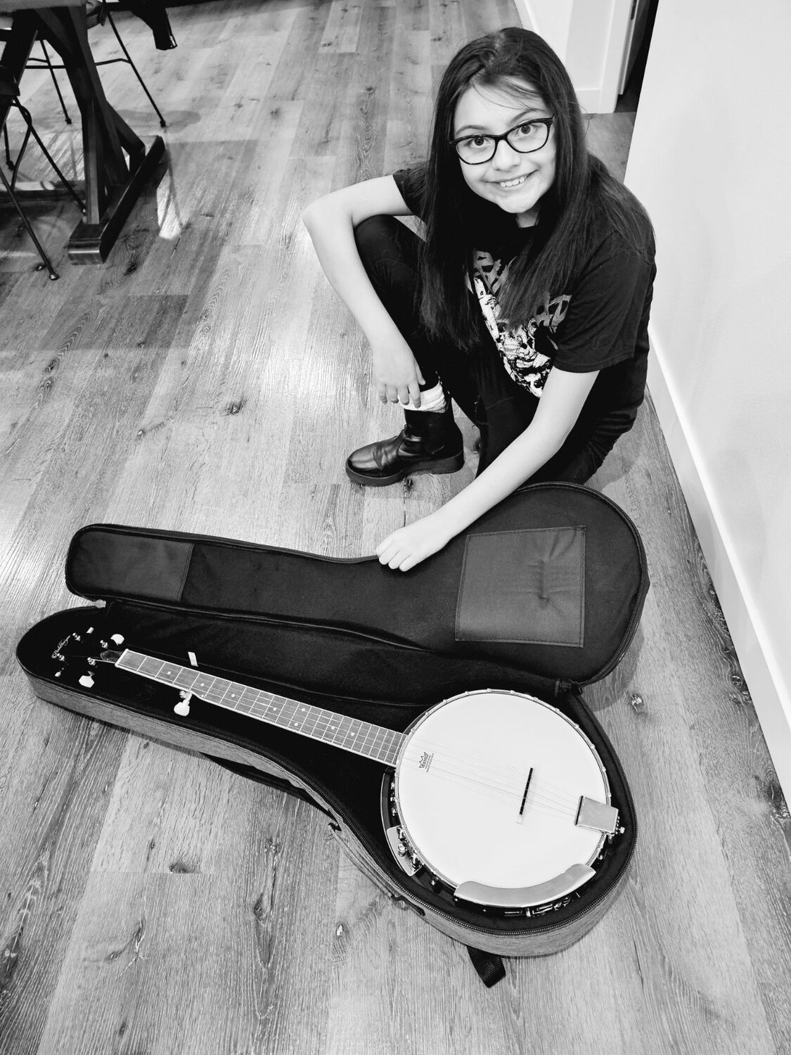Sofia Lopez with her banjo. Lopez takes weekly banjo lessons from Bob Goodwin.