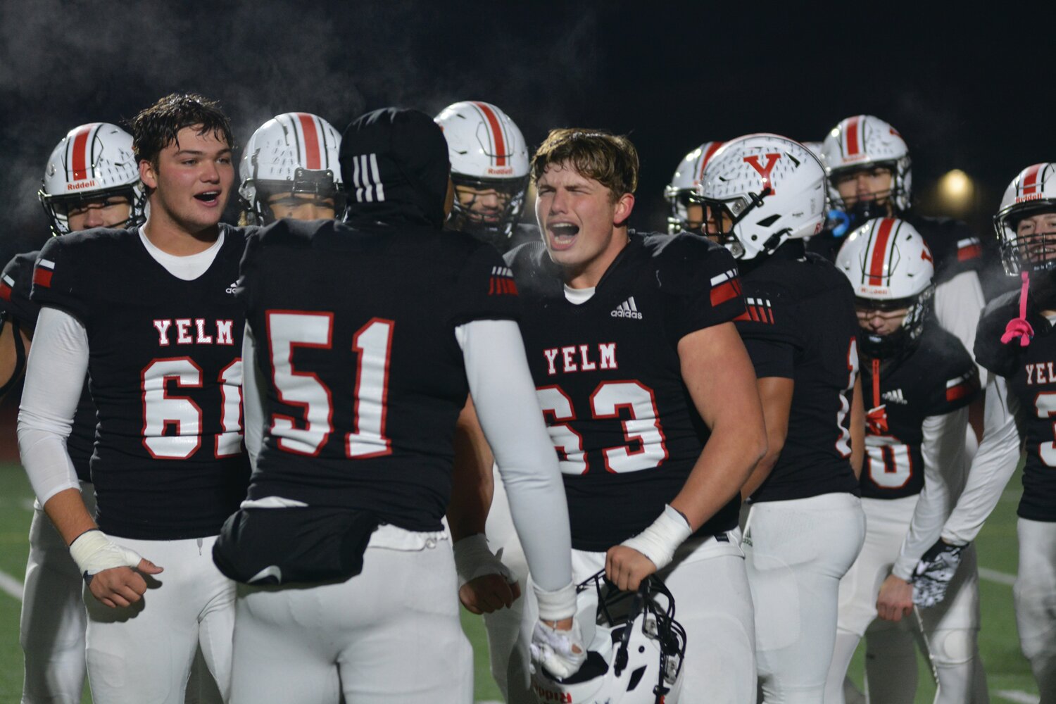 Yelm linemen Chris Hauss (61), Damien Williams-Butler (51), and Jonah Smith (63) celebrate on Nov. 25 after defeating the Eastside Catholic Crusaders 7-0 to advance to the 3A State Championship game against Bellevue.