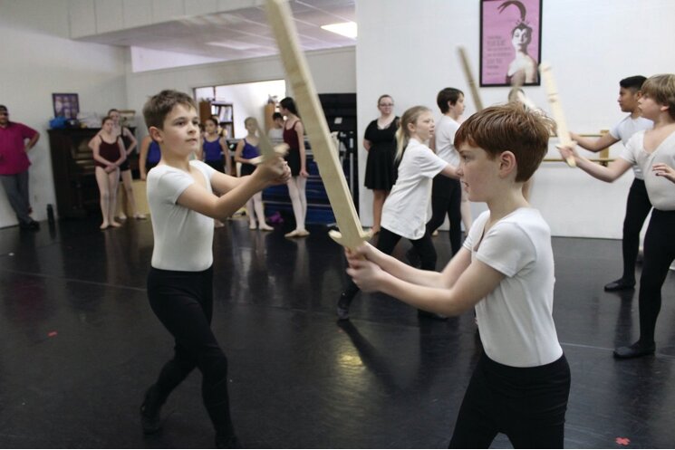 Alexander Kellum (right) prepares for a fight scene during a rehearsal for "The Nutcracker."