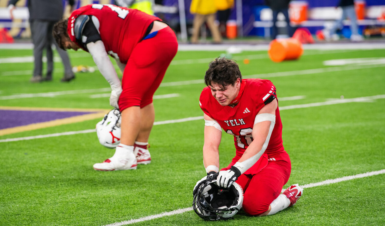 Yelm linebacker Nathan Ford, front, and lineman Landen Barger, back, react after the Tornados’ loss to Bellevue during the 3A state football championship game on Friday, Dec. 1, at Husky Stadium in Seattle.