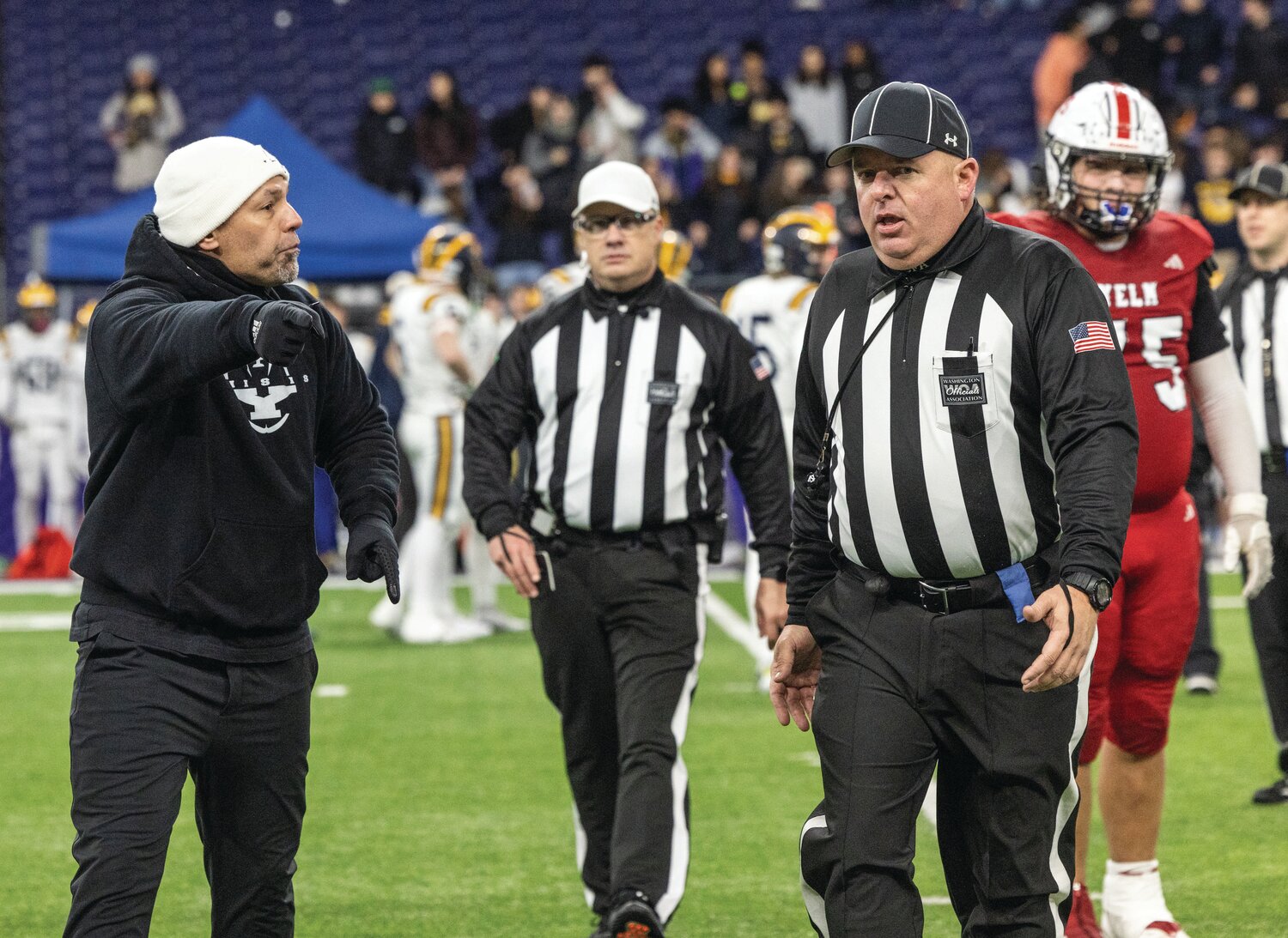 Yelm head coach Jason Ronquillo argues with referees about a call in favor of the Bellevue Wolverines during the 3A state championship game at Husky Stadium on Friday, Dec. 1.