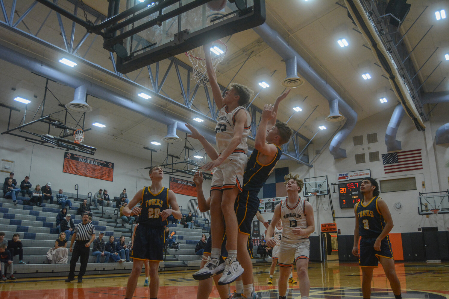 Peyton Sheaffer (22) attempts a bank layup against Forks on Dec. 2.