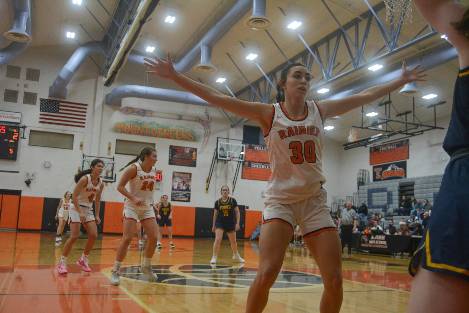 Acacia Murphy (30) defends the inbounds pass as Rainier sets up its full-court press against Forks on Dec. 2.