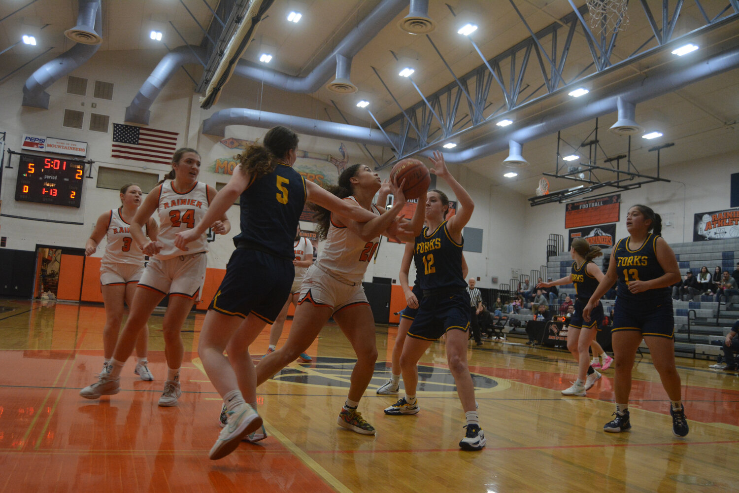 Janess Blackburn (20) drives into the paint and attempts a shot through contact on Dec. 2.