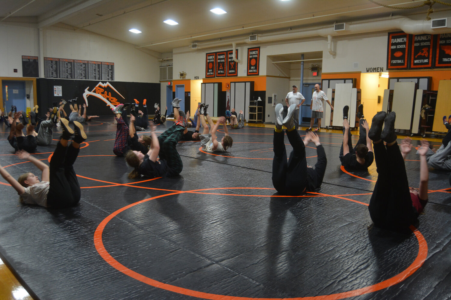 Chris Holterman and the Rainier wrestling coaches lead the team through a practice on Nov. 30.