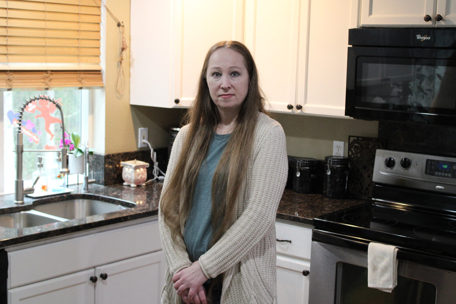 Dee Ragsdale, owner of Whimsy Cakes by Dee, poses in her kitchen on Jan. 29.